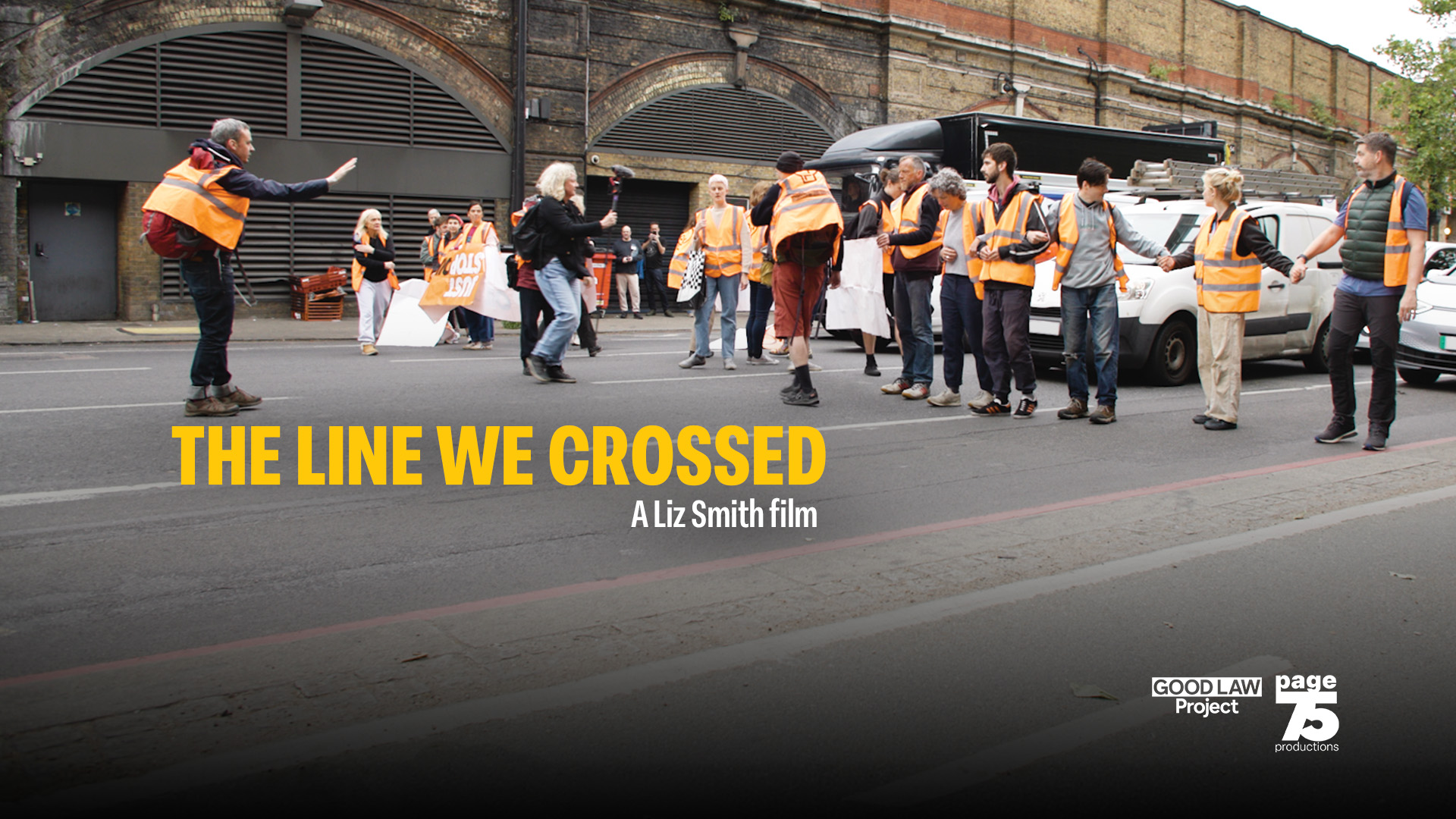 Image is a still from the film showing protestors standing in a lin in a road. Text reads The line we crossed, a Liz Smith film